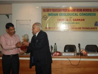 Prof. O. P. Varma presenting memento to Prof. B. C. Sarkar.