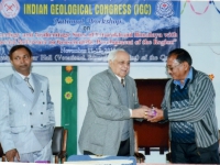 Prof. O.P. Varma presenting accolade on behalf of the Indian Geological Congress to Dr. D. S. Pangtey, Principal, Govt. Post- Graduate College, Pithoragrah. On the left is Dr. R. A. Singh, Convenor of the National Workshop & Gead (Geol.) Deptt. In the same college