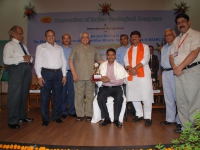 Prof. B.C. Sarkar received the IGC Distingushed Award from Prof. O.P. Varma. 