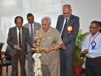 At the lighting of the sacred lamp for the blessings of the Divine by: Prof. O.P. Varma. On his right is Dr. Harsh K. Gupta, and on left, Shri Roopwant Singh, IAS, Commissioner, CGM & MD, Gujarat Mineral Development Corporation Ltd., Dr.D.K. Sinha, Director, AMD and Shri B. Saravanan, Additional Director, AMD are also seen